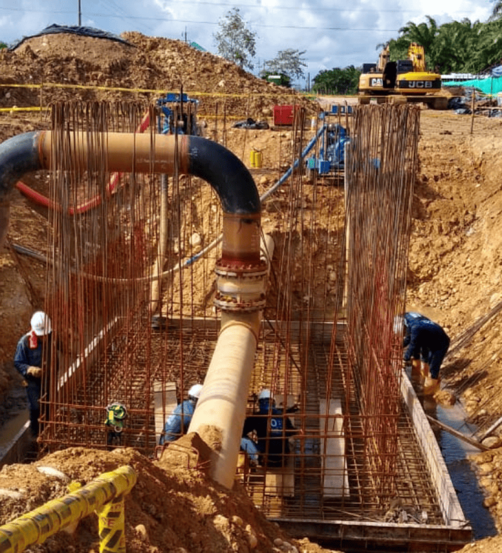 Concrete foundation works and piping installation in a trench