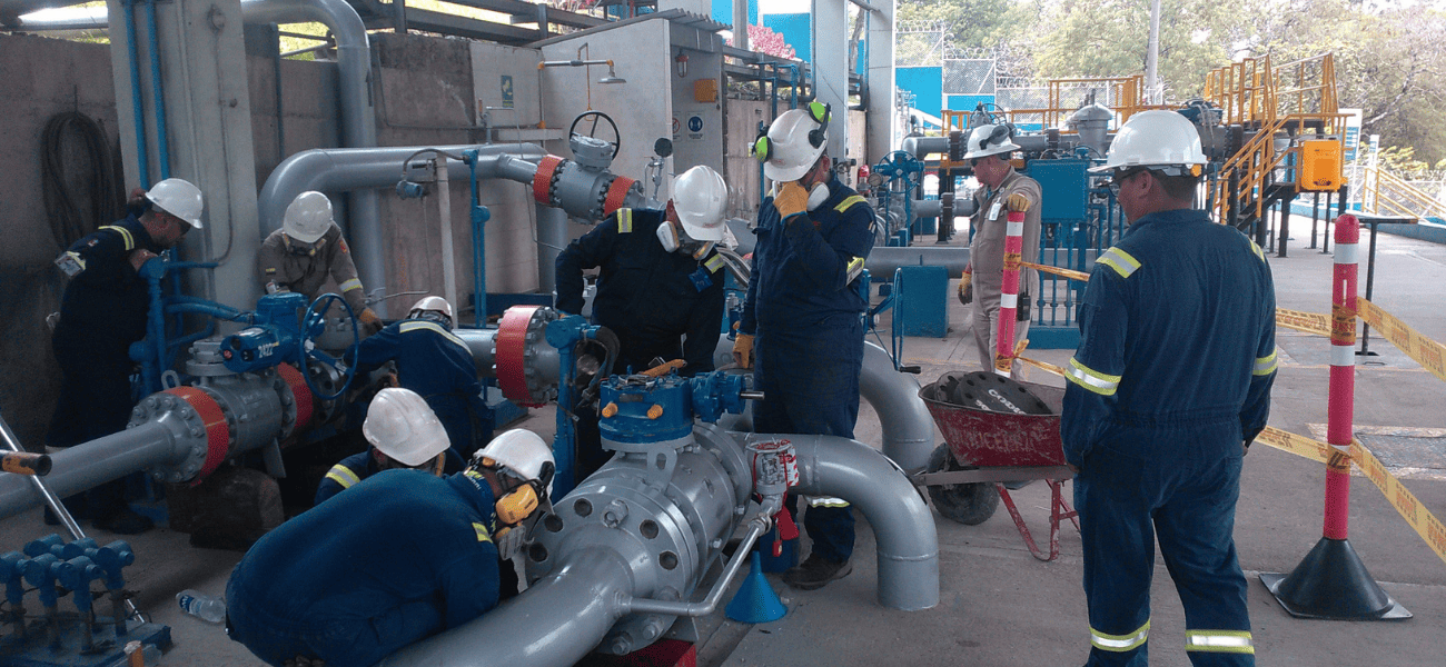 OBS crew working on the manifold of a pumping system